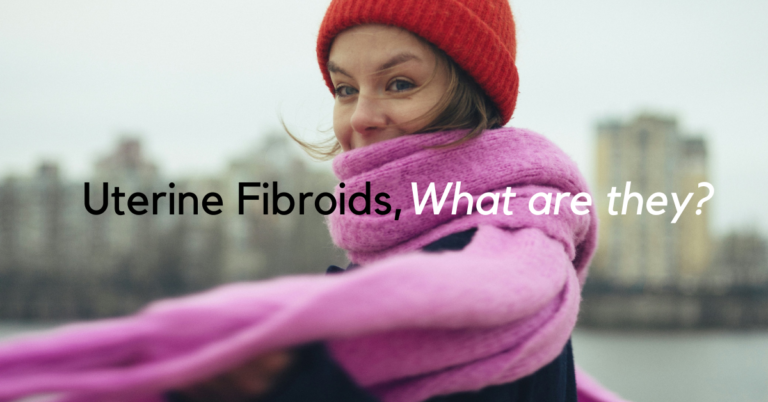 women wearing pink scarf, looking at camera. writing says:? uterine fibroids, what are they?